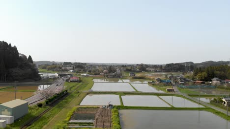 Calm-and-relaxing-aerial-drone-footage-of-rural-Japan-with-water-rice-fields
