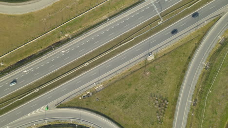 Aerial-circling-shot-showing-cars-driving-on-S7-Expressway-in-Poland-during-sunlight-in-summer
