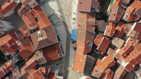 Top-Down-View-Of-Croatian-Roof-Tiles-In-the-Town-Of-Cres,-Croatia---aerial-shot