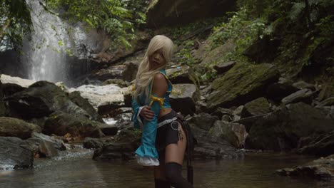 A-butterfly-fly-past-an-anime-cosplayer-Lucy-heartfilia-while-posing-at-the-base-of-an-epic-waterfall