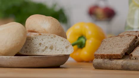 Slide-right-shot-4k-of-two-types-of-bread,-white-bread-made-of-wheat-flour-and-wholemeal-rye-bread