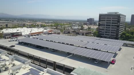 Aerial-view,-solar-panels-on-Topanga-Canyon-Mall,-Renewable-energy