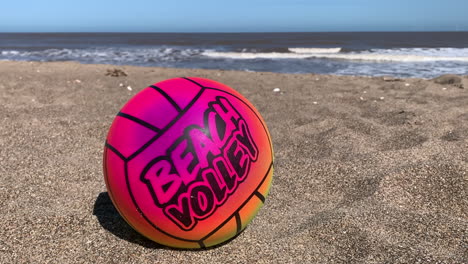 A-colorful-volley-ball-on-the-beach-with-the-ocean