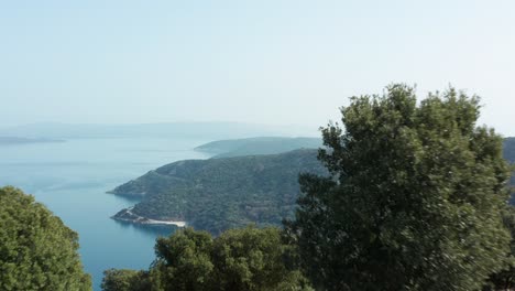 Aerial:-Croatian-coastal-reveal-over-island-of-Cres-hilltop,-Adriatic-Sea