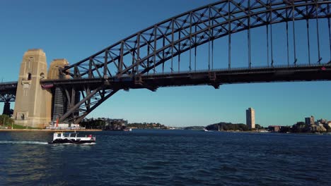 Boat-Sailing-At-Port-Jackson-Near-The-Famous-Sydney-Harbour-Bridge-In-NSW,-Australia