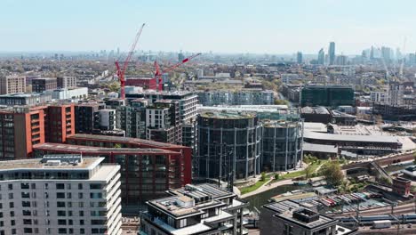 Overhead-drone-shot-of-gasholder-apartments-and-park-kings-cross-London