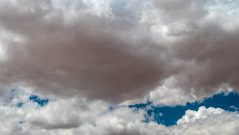 Cumulus-clouds-create-abstract-formations-against-the-blue-sky---time-lapse