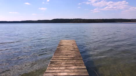 Wooden-pier-beside-a-picturesque-lake