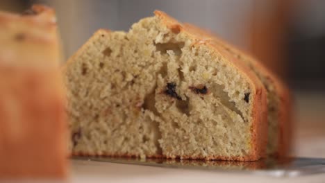 Picking-Up-a-Slice-of-Chocolate-Chip-Bread,-Close-Up