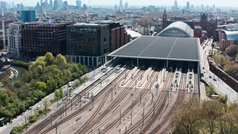 Rising-pan-down-drone-shot-of-train-tracks-from-London-st-Pancras-station