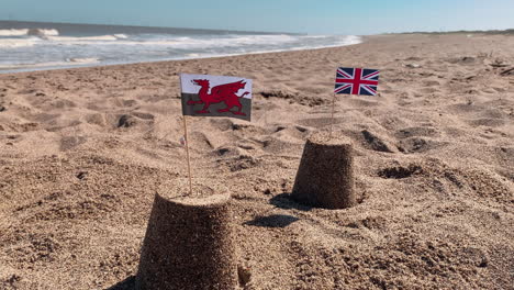 Two-sandcastles-on-a-British-beach-in-Wales