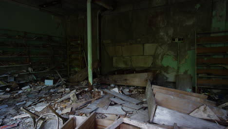 Destroyed-furniture-and-bookshelves-in-abandoned-commercial-building,-Pripyat