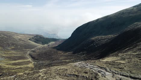 Sliding-aerial-view-of-Mournes-valley-leading-to-Newcastle-town