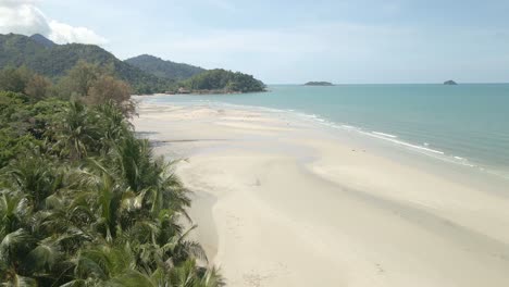 Scenic-Aerial-View-on-Koh-Chang-Tropical-Island-with-White-Sand-and-Coconut-Palm-Trees-with-Ocean-Waves-in-Amazing-Thailand