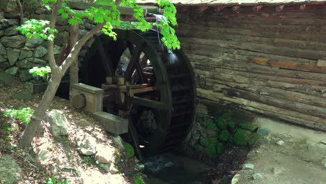 Big-Water-Wheel-as-a-part-of-Watermill-In-A-Zen-Garden-At-A-Korean-Folk-Village--full-shot