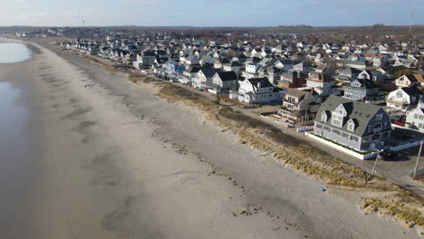 Aerial-footage-showing-houses-lining-Nantasket-Beach-in-Hull,-MA,-USA