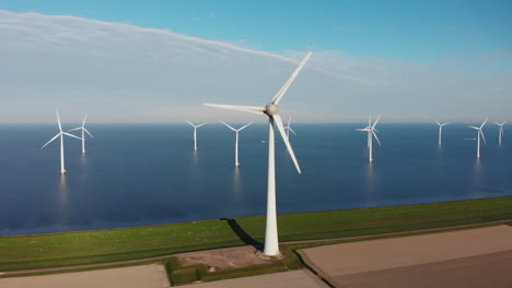 Wind-Turbines-In-Calm-Blue-Sea-On-A-Sunny-Day-In-Netherlands