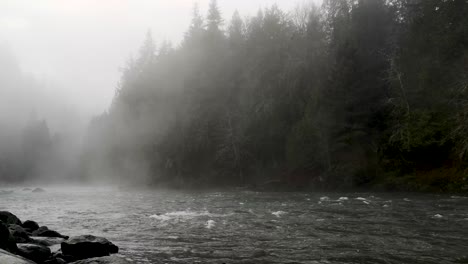 Calm-Water-Flowing-With-Fog-At-Snoqualmie-River-In-King-County,-Washington