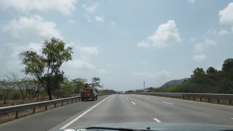 Overtaking-a-bus-on-Pune-Mumbai-Expressway-in-India-on-a-sunny-day