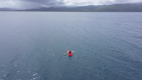Adult-Man-Kayaking-At-Blue-Sea-With-Calm-Waves-Near-San-Pablo-Island-In-Hinunangan,-Leyte-Philippines