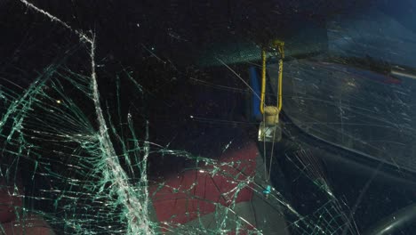 Closeup-Of-A-Broken-Windshield-On-A-Car,-Windscreen-Glass-Shattered-On-Accident-Impact