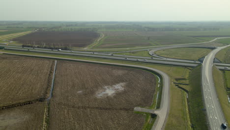 back-flight-aerial-over-expressway-in-Poland,-sunshine-and-clear-sky