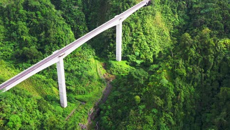 Aerial-View-Of-Agas-Agas-Bridge-With-Green-Mountains-On-The-Pan-Philippine-Highway-In-Sogod,-Southern-Leyte,-Philippines