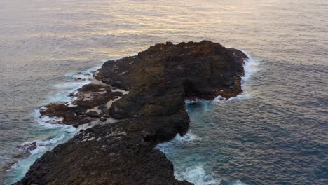 Blow-Hole-Point---Aerial-View-Of-Rocky-Peninsula-Of-Blowhole-At-Sunrise-In-Kiama,-NSW,-Australia
