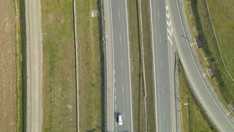 Cars-traffic-on-highway-road-S7-Cdry-Poland-Aerial-view-from-top-to-bottom-daytime