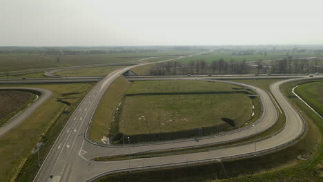 The-drone-takes-off-revealing-infinity-road-interchange-at-highway-road-S7-Cdry-in-Poland