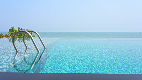 Crystal-Clear-Water-of-Infinity-Swimming-Pool-with-Sea-View-Backdrop