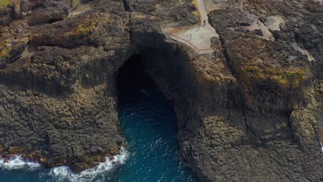 Aerial-View-Of-Kiama-Blowhole-Sea-Cave-Entrance-In-Kiama,-NSW,-Australia