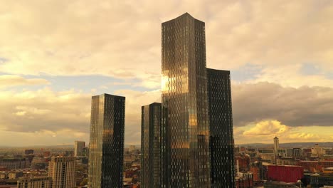 Aerial-drone-close-up-Deansgate-Square-Manchester-skyscraper-golden-hour,-England