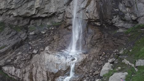 Close-Drone-flight-waterfall-Almenbachfall-Berner-Oberland-Switzerland