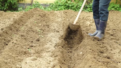 Man-Tilling-Soil-With-Shovel.-cropped-shot