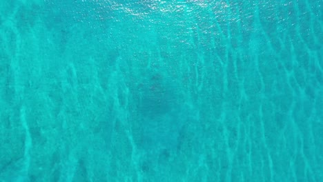Aerial-top-down-view-of-blue-turquoise-sea-water-texture