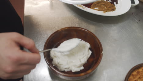 Chef-prepares-mediterranean-starter-yogurt-dish