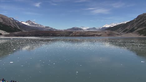 Icy-waters-of-Tarr-Inlet-and-Glacier-covered-by-volcanic-ash,-Glacier-Bay-National-Park-and-Preserve,-Alaska