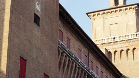 Este-Castle-clock-tower-in-Ferrara,-Italy,-UNESCO-World-Heritage-Site,-tilt-up