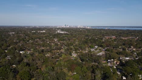 Aerial-view-above-the-Murray-Hill-neighborhood,-Downtown-Jacksonville-in-the-background---tracking,-drone-shot