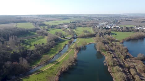 Aerial-pull-back-view-Chartham-Kent-countryside-river-Stour-Canterbury-English-village-scene
