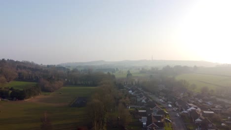 Drone-flight-over-lyminge-town-with-blue-sky