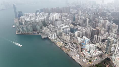 Hong-Kong-bay-coastline-and-waterfront-skyscrapers,-Aerial-view