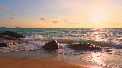 Ocean-waves-crashing-on-rocky-beach-during-sunset