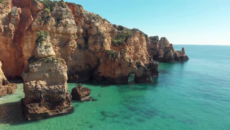 Turquoise-clear-ocean-waters-and-cliffs,-Lagos,-Algarve,-Portugal