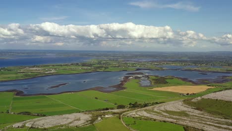 Irish-Rural-Landscape,-view-from-East-Burrin-looking-towards-Kinvara-Bay,-Clare,-Ireland,-August-2020,-Drone-gradually-pushes-East-towards-Galway