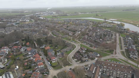 Aerial-of-suburban-neighborhood-in-small-Dutch-town-near-river