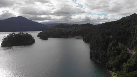 Aerial-flight-along-shoreline-of-forested-Lago-Nahuel-Huapi,-Patagonia