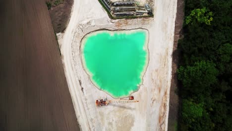Aerial-View-of-Rock-Quarry-in-Munich-Germany---Top-Down-Zooming-Out-View
