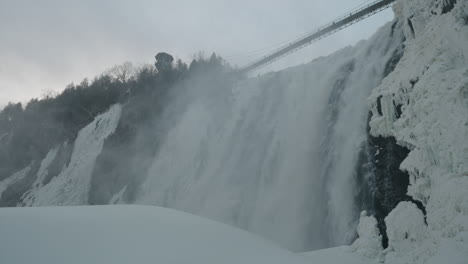 Chute-Montmorency--Frozen-Montmorency-Falls-With-Suspension-Bridge-At-Winter-On-Montmorency-River-In-Quebec,-Canada